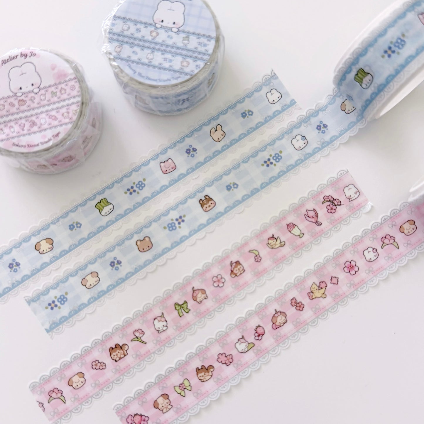 Decorative washi tape with cartoon designs on a white background