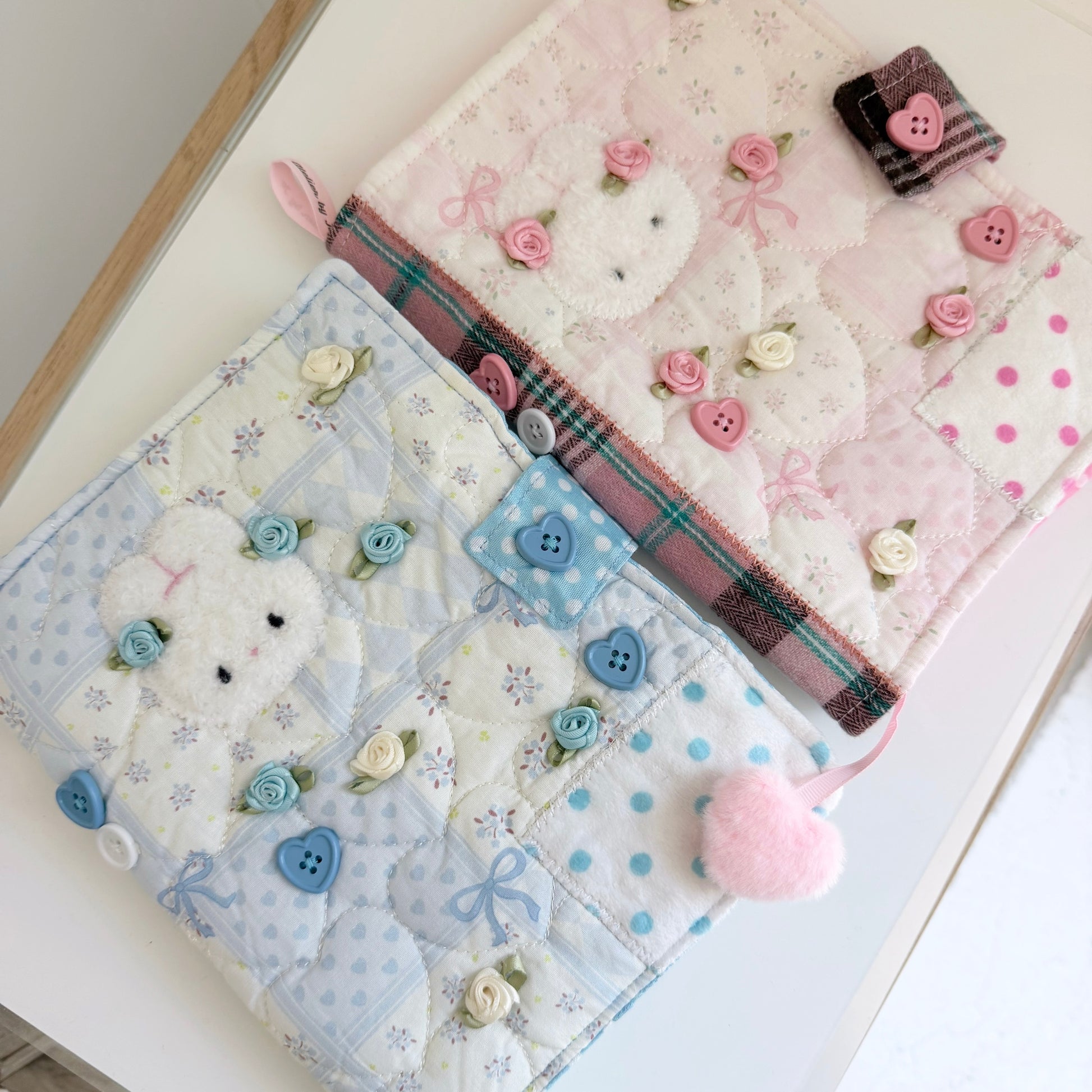 Blue and Pink A5 fabric journal covers on a white surface
