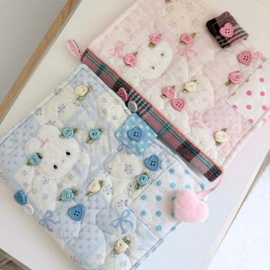 Blue and Pink A5 fabric journal covers on a white surface