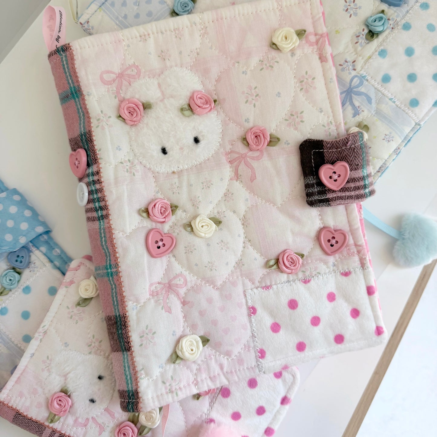 Pink A5 Journal Cover on a multicolored surface