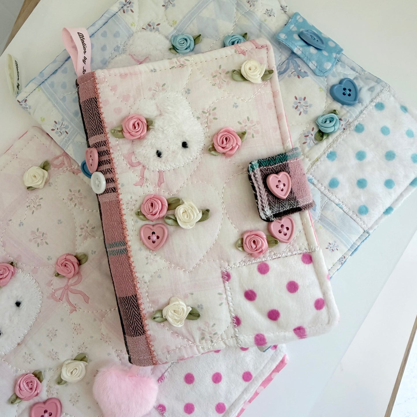  Pink A6 fabric journal covers on a white surface