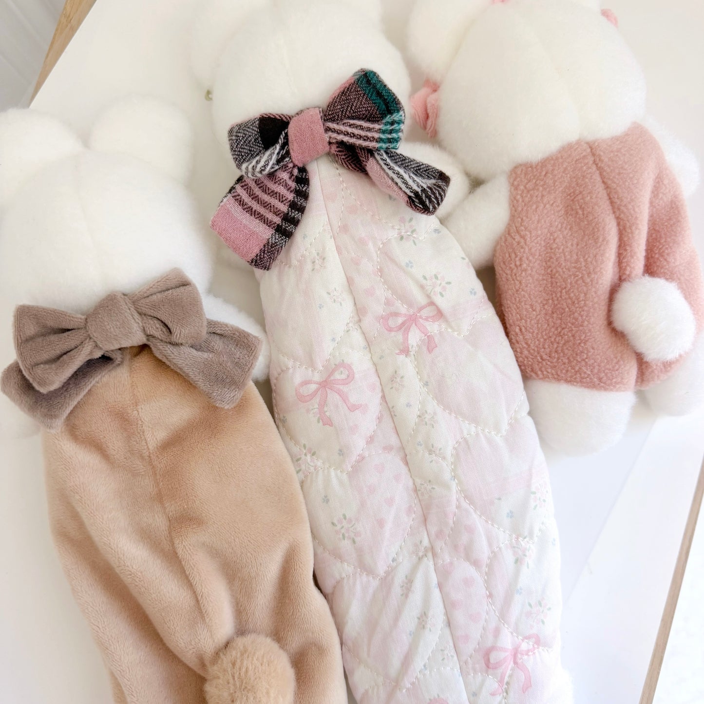 Back view of three differently sized pencil and accessory bunny pouches