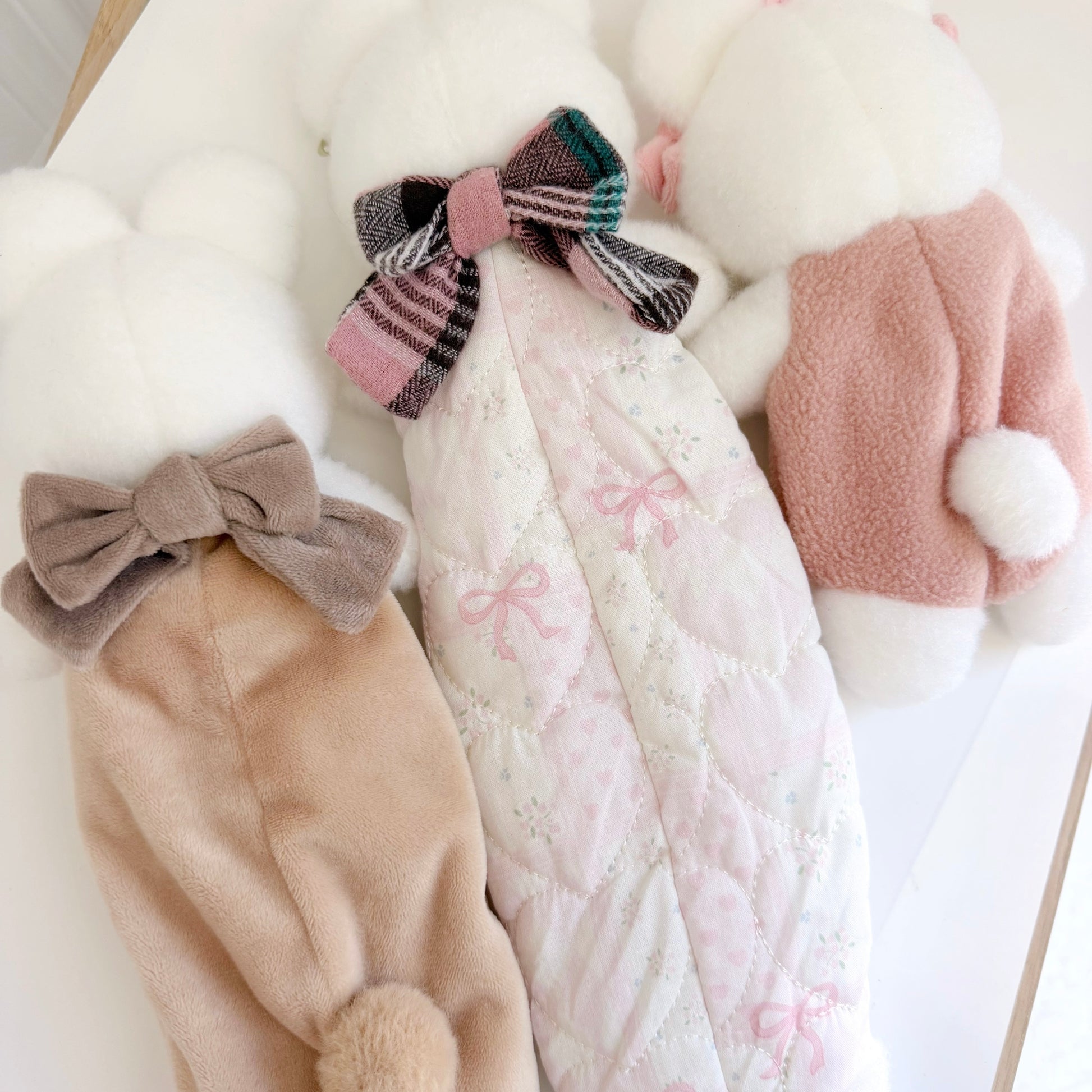 Back view of three differently sized pencil and accessory bunny pouches