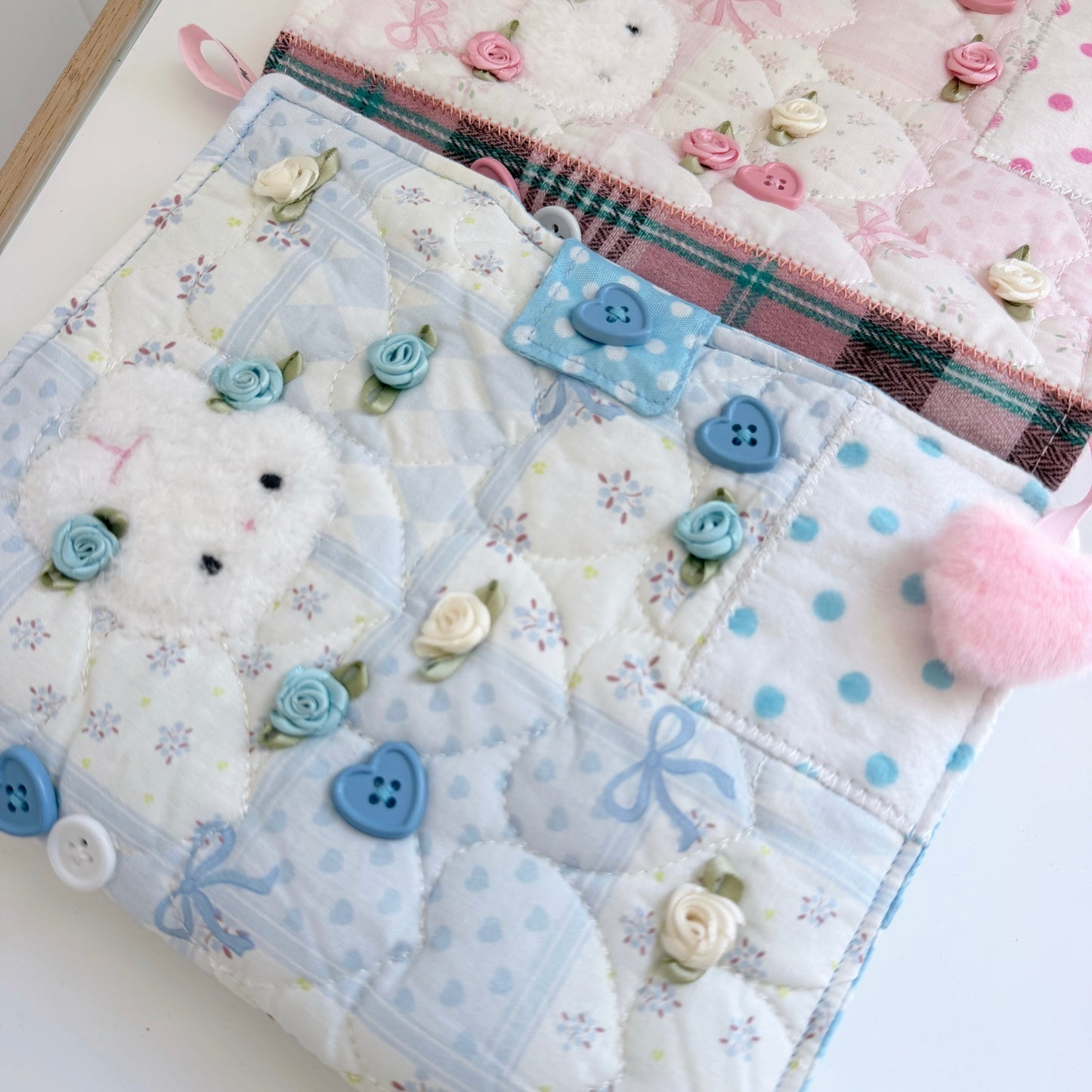Blue and Pink A5 fabric journal covers on a white surface