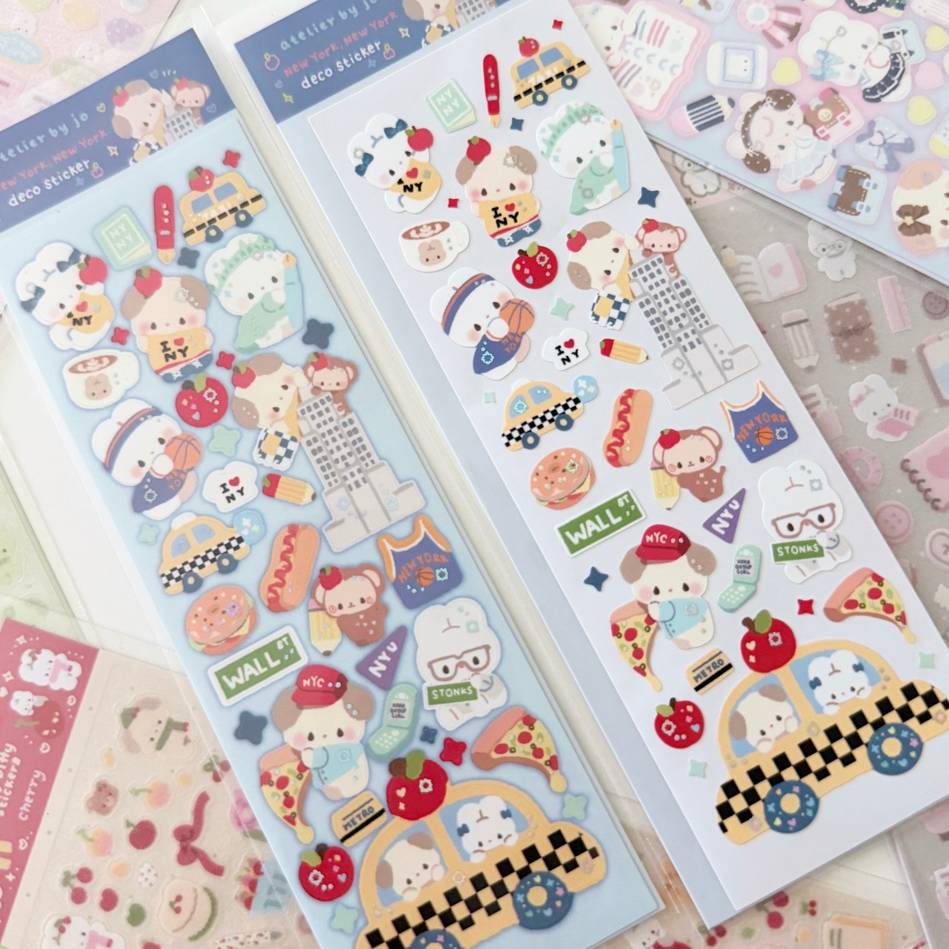Two sheets of cute cartoon animal stickers displayed on a light background, featuring characters in school, food, and taxi themes.