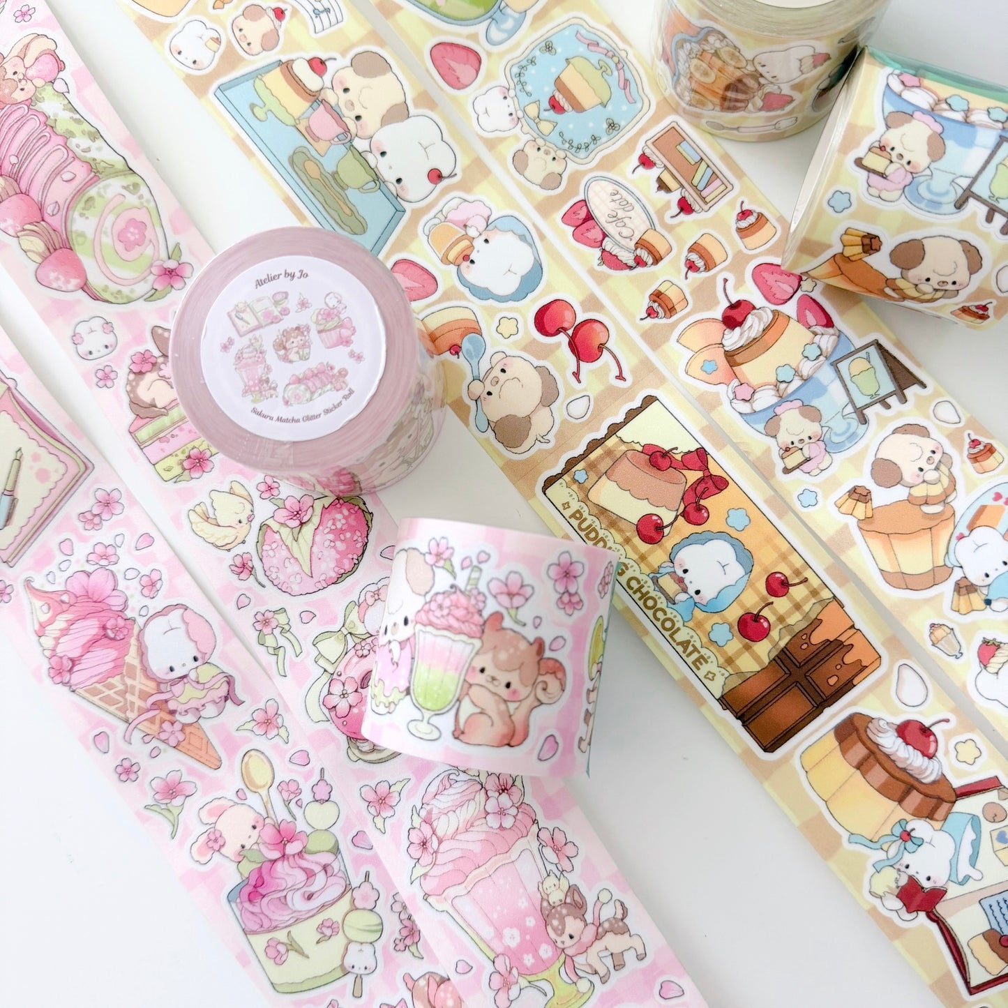 Collection of colorful stationery items with cartoon designs on a white surface