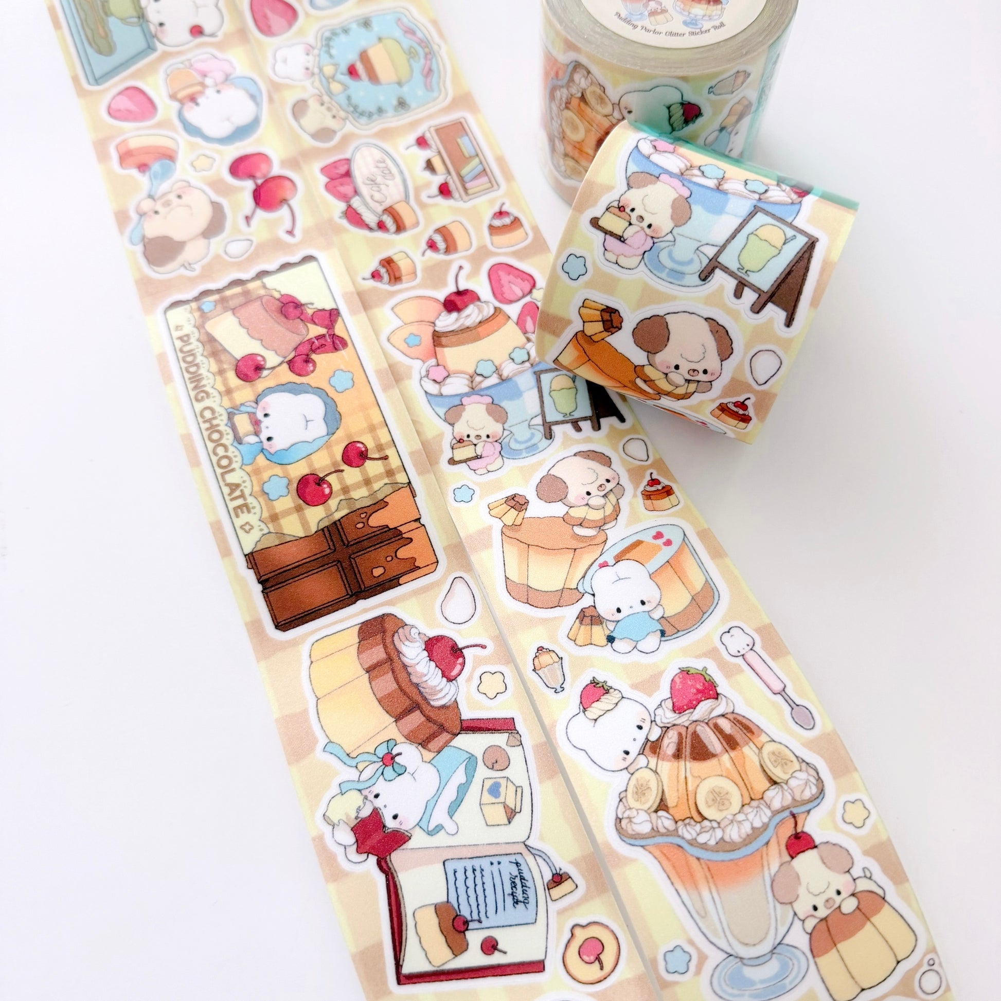 Rolls of decorative stickers with cute illustrations on a white background