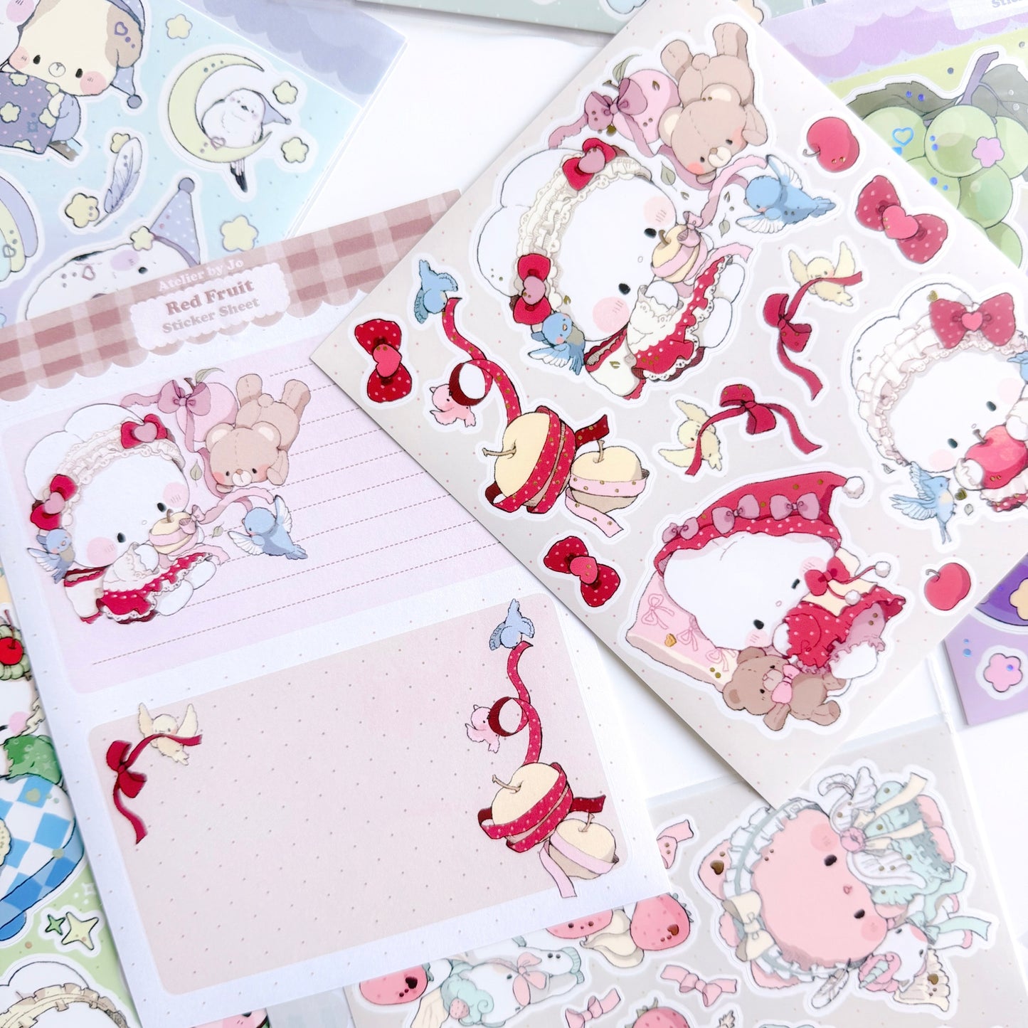 Sticker sheet with cute animal characters and decorative elements on a beige background