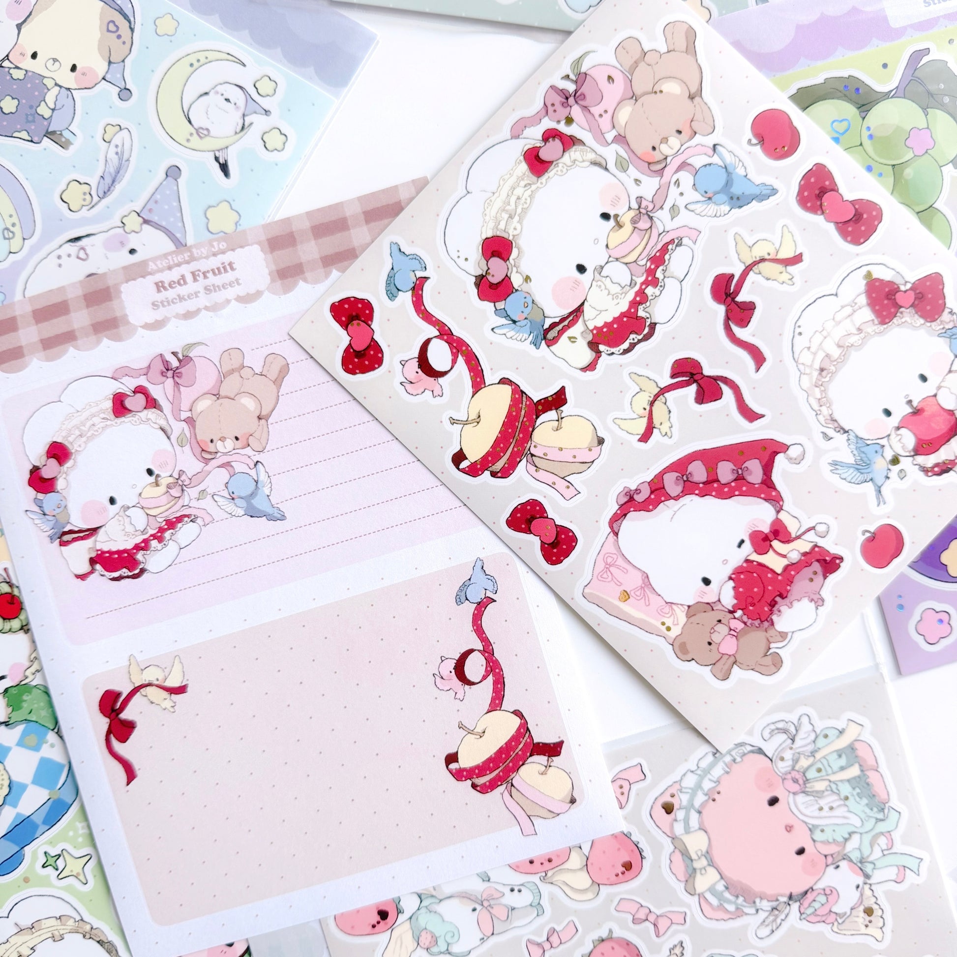 Sticker sheet with cute animal characters and decorative elements on a beige background