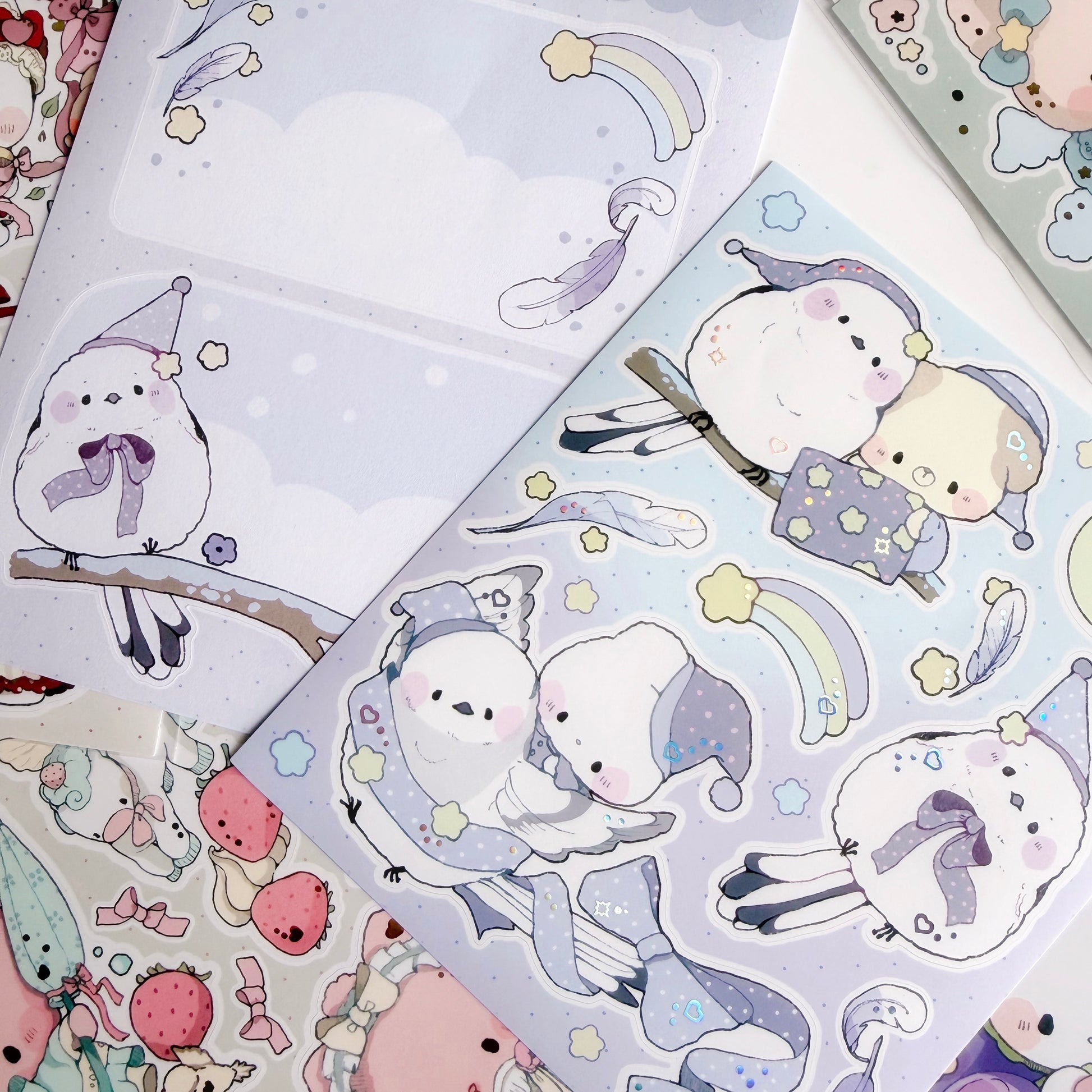 Sticker sheet with cute bird and puppy design on a white and blue background